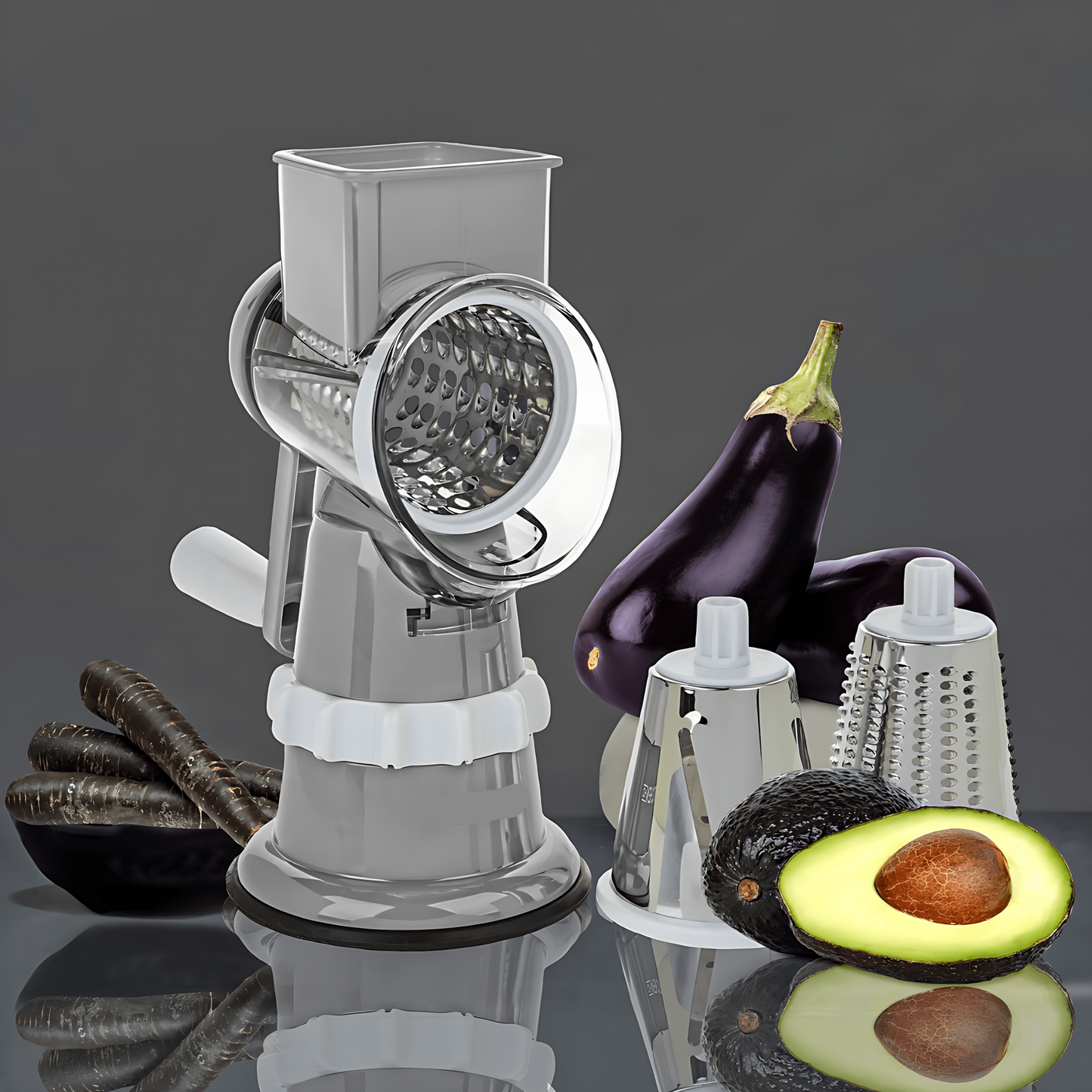Manuelle Trommelreibe aus Edelstahl mit Gemüse und Avocado, ideal für Küche und Kochen.