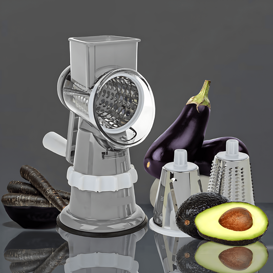 Manuelle Trommelreibe aus Edelstahl mit Gemüse und Avocado, ideal für Küche und Kochen.