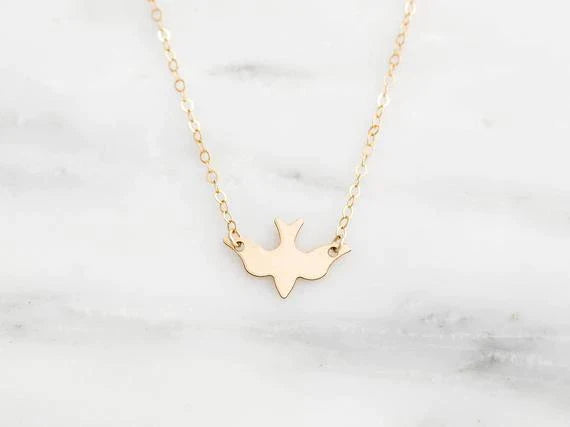 Goldene Halskette mit Taubenanhänger, filigranes Design, Damen-Schmuck, Geschenkidee.