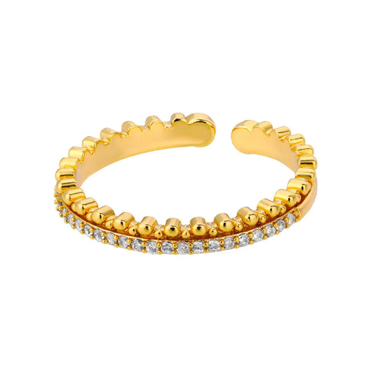 Goldener offener Ring mit Zirkonia-Steinen, elegantes Schmuckdesign, modisches Accessoire.