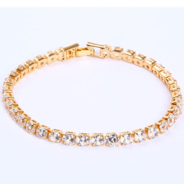 Goldenes Tennisarmband mit klaren Kristallen, eleganter Schmuck, Damenaccessoire, Geschenkidee.