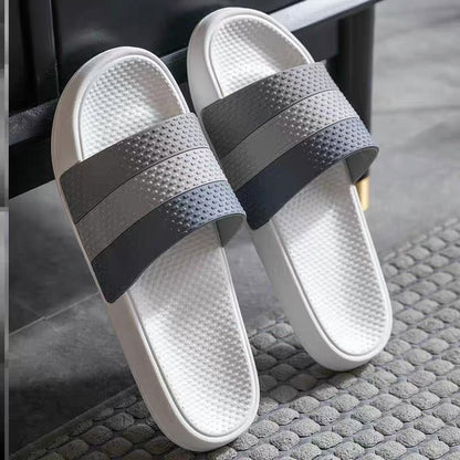 Graue und weiße Badeschlappen, rutschfest, Unisex, Badezimmer, bequem, modern.