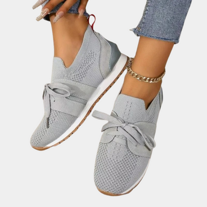Graue Damen-Sneaker, Strickmaterial, Schleifen-Detail, lässig, bequem, modisch.