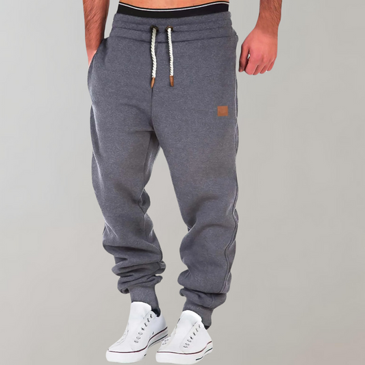 Graue Herren-Jogginghose mit Kordelzug, bequem, sportlich, Baumwolle, ideal für Fitness.
