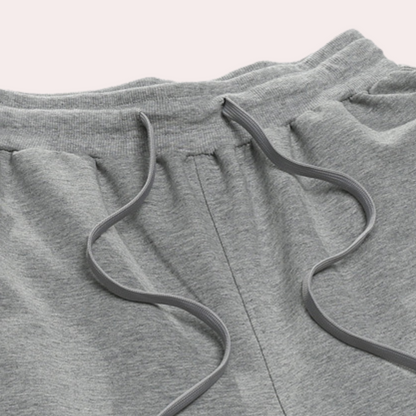 Graue Jogginghose aus Baumwolle mit Kordelzug, bequeme Sportbekleidung für Herren.