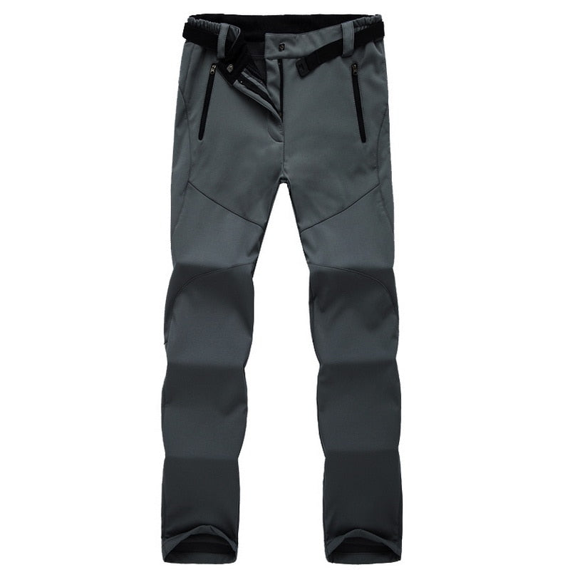 Graue Outdoor-Hose, wasserdicht, mit Reißverschlusstaschen, ideal für Wandern und Trekking.