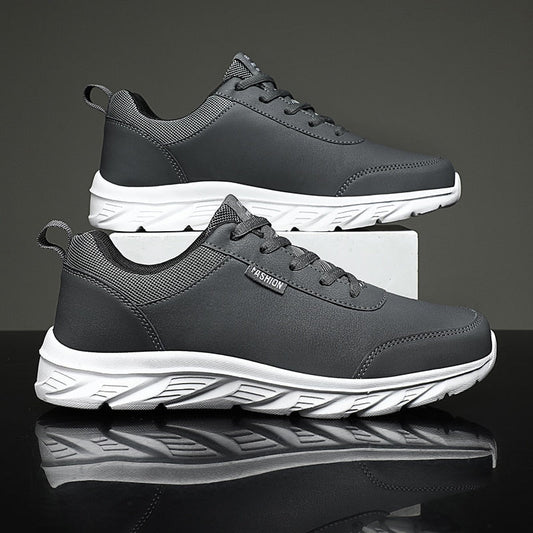 Graue Herren-Sneaker, atmungsaktiv, rutschfest, modisch, mit weißer Sohle.