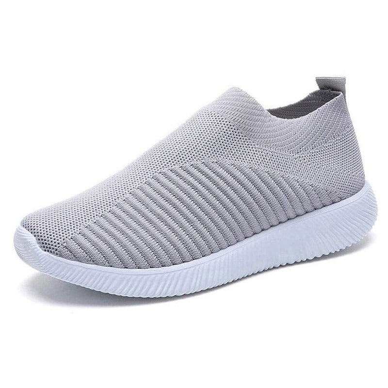 Grauer Sneaker aus Mesh, atmungsaktiv, rutschfeste Sohle, ideal für Sport und Freizeit.