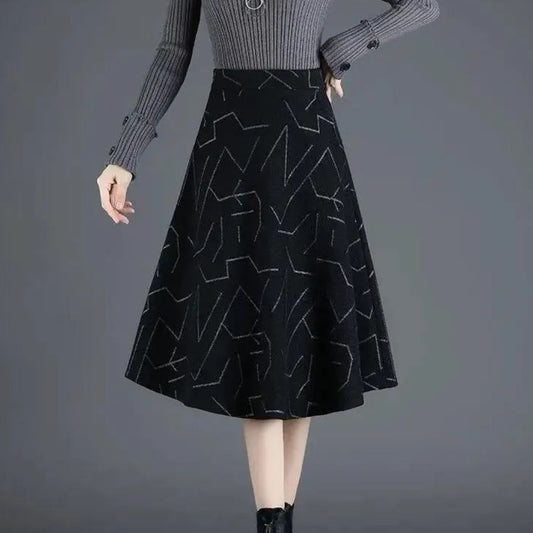Damen A-Linien-Rock, schwarz, geometrisches Muster, knielang, elegantes Design, Herbstmode.