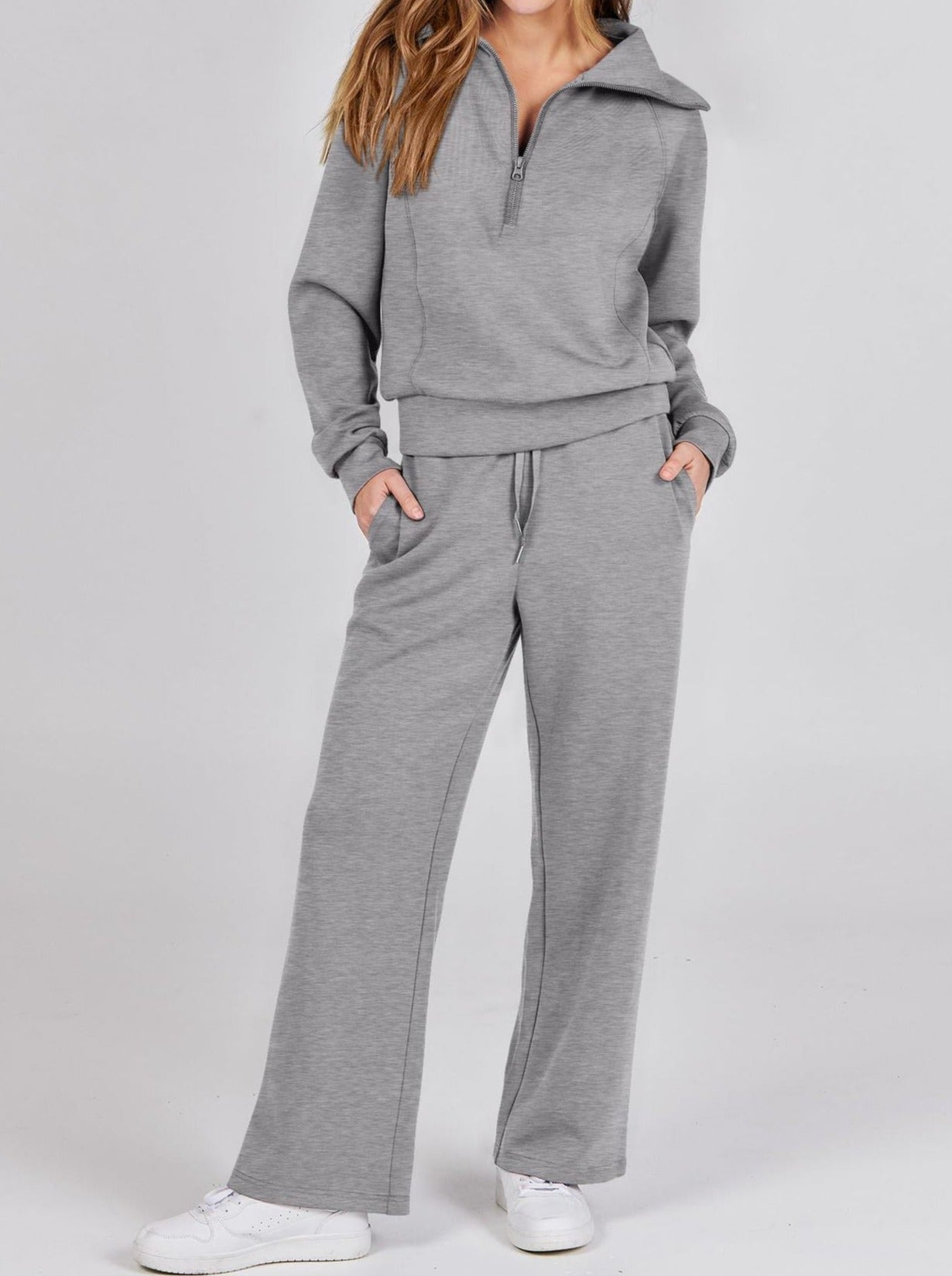 Grauer Damen-Jogginganzug, langärmelig, mit Reißverschluss, bequem, Freizeitmode.