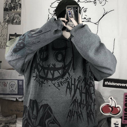 Grauer Oversize-Pullover mit schwarzem Graffiti-Design, Unisex Streetwear, Baumwolle.