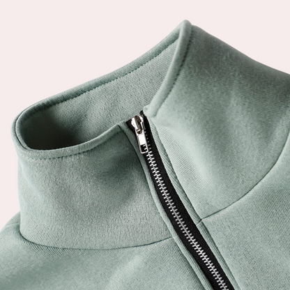 Grüner Damenpullover mit Reißverschluss, hoher Kragen, Baumwolle, modisch, bequem.