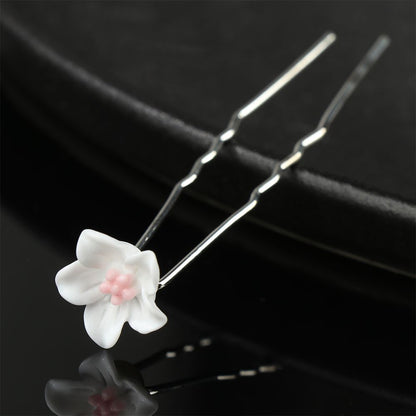 Weiße Haarspange mit Blume, Metall, elegant, Haarschmuck, Hochzeit, Damenaccessoire.
