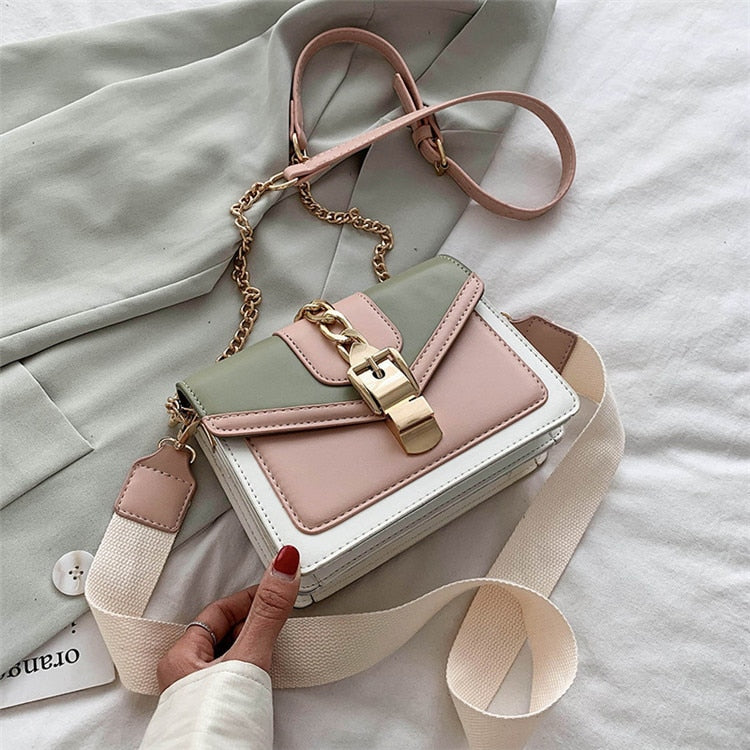 Damenhandtasche aus Leder, mehrfarbig, mit Kettengurt und Schnalle, modisch und elegant.