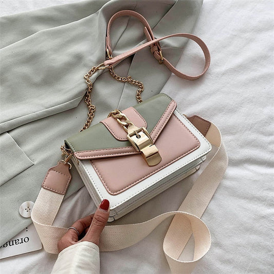 Damenhandtasche aus Leder, mehrfarbig, mit Kettengurt und Schnalle, modisch und elegant.