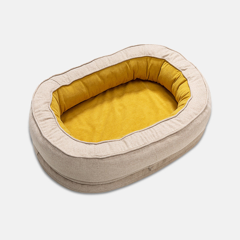 Beiges Hundebett oval, gelbes Innenfutter, Baumwolle, gemütlich, Haustierbett, waschbar.