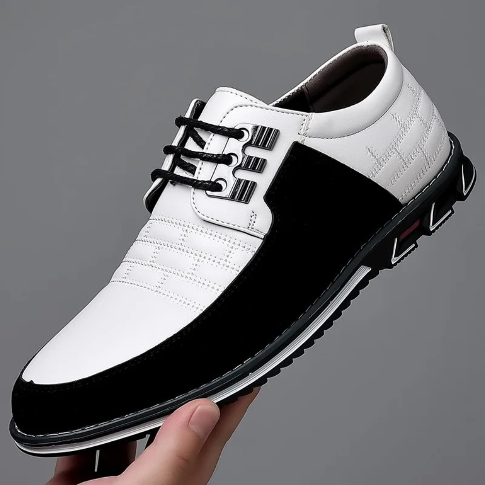 Weißer und schwarzer Herren-Lederschnürschuh, elegantes Design, rutschfeste Sohle.