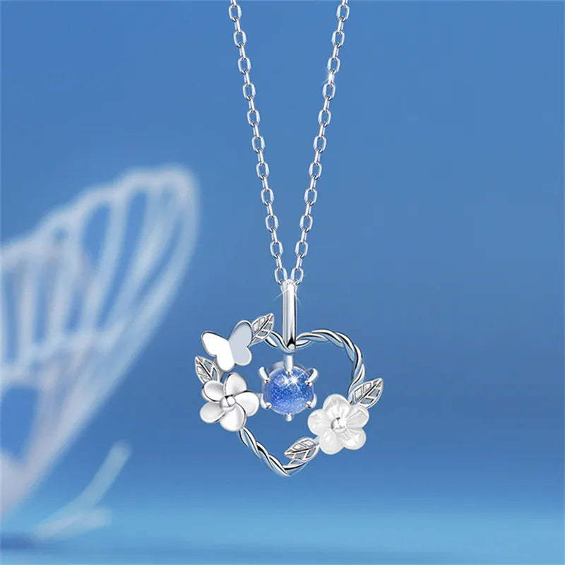 Silberne Halskette mit Blumen- und Schmetterlingsanhänger, blauer Kristall, Damen-Schmuck.