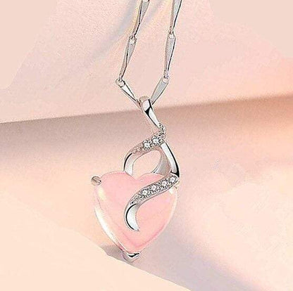 Silberne Herz-Halskette mit rosa Opal und Zirkonia, elegantes Schmuckdesign.