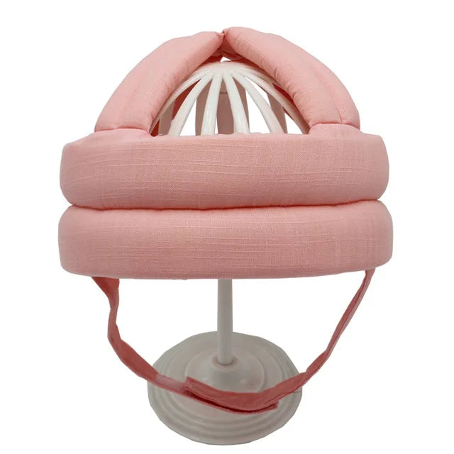 Rosa Baby-Schutzhelm aus Baumwolle, verstellbar, stoßfest, für Kleinkinder.
