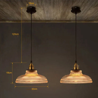 Zwei industrielle Pendelleuchten aus Glas, 30 cm Durchmesser, 120 cm Kabel, warmes Licht.