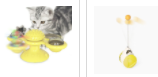 Graues Kätzchen spielt mit gelbem interaktivem Katzenspielzeug, rotierende Bälle, Kunststoff.