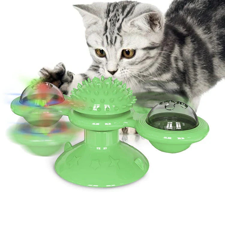 Grünes Katzenspielzeug mit Spinnfunktion, interaktiv, Kunststoff, für Unterhaltung und Bewegung.