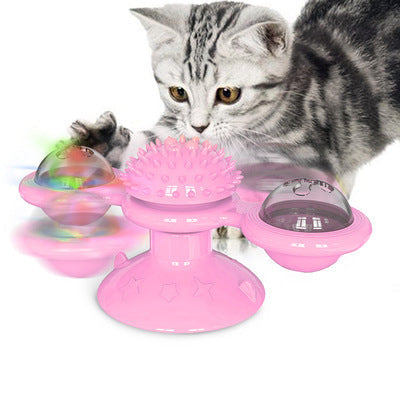 Rosa Katzenspielzeug mit drehenden Kugeln und Noppen, interaktives Spielzeug für Katzen.