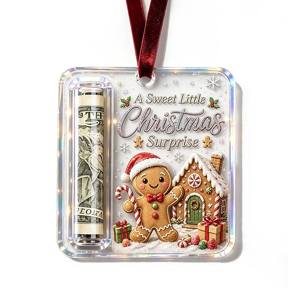Anhänger mit lächelndem Lebkuchenmann mit Weihnachtsmütze vor einem Lebkuchenhaus, links die eingerollte Geldnote. 20
