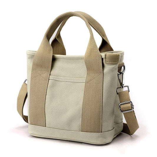 Beige Canvas-Umhängetasche für Damen, kleine Größe, verstellbarer Riemen, modisch und praktisch.