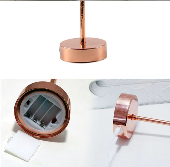 Kupferfarbene LED-Tischlampe, batteriebetrieben, modernes Design, ideal für Schreibtischbeleuchtung.