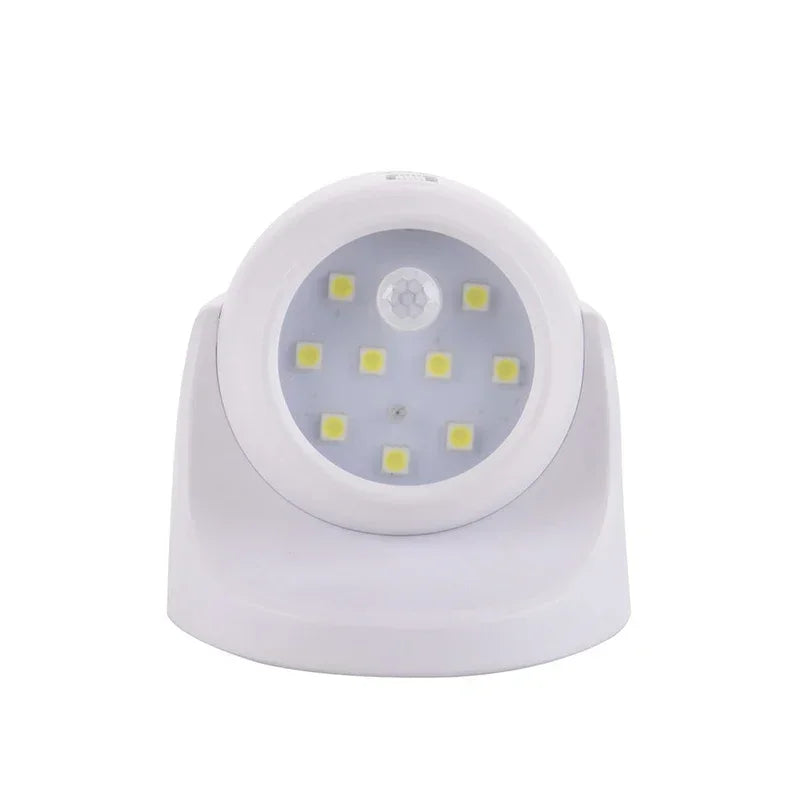 Weiße LED-Nachtlampe mit Bewegungssensor, batteriebetrieben, energiesparend, rundes Design.