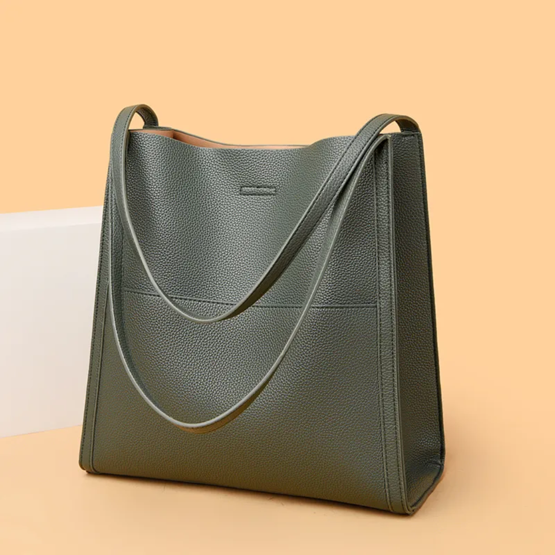 Grüne Ledertasche mit langen Henkeln, elegantes Design, Damenhandtasche, modisch.