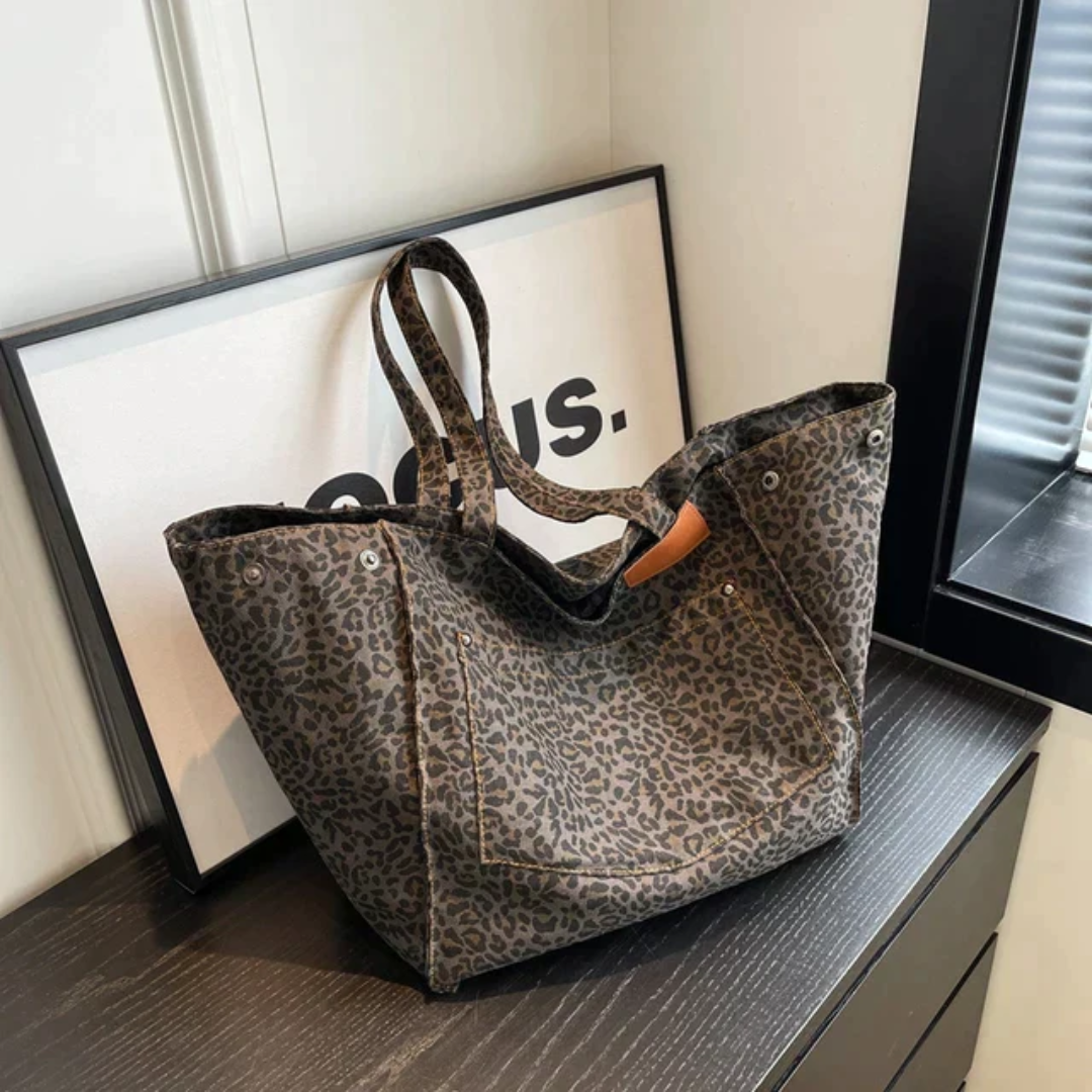 Leopardenmuster Einkaufstasche, braun, Stoff, modisch, Damenaccessoire, auf schwarzem Tisch
