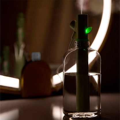 Grüner Luftbefeuchter in Flaschenform, modernes Design, LED-Licht, für Zuhause oder Büro.