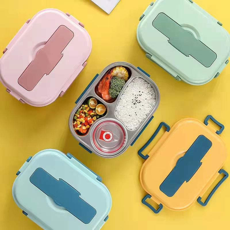 Bunte Bento-Boxen aus Kunststoff mit Fächern für Lebensmittel, ideal für Mahlzeiten unterwegs.