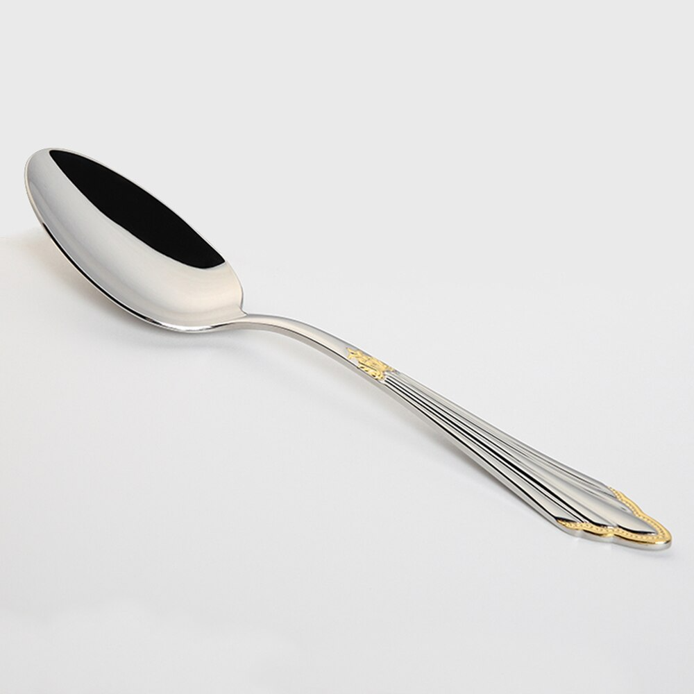 Luxuriöser Edelstahl-Löffel mit goldenen Verzierungen, ideal für gehobene Gastronomie.