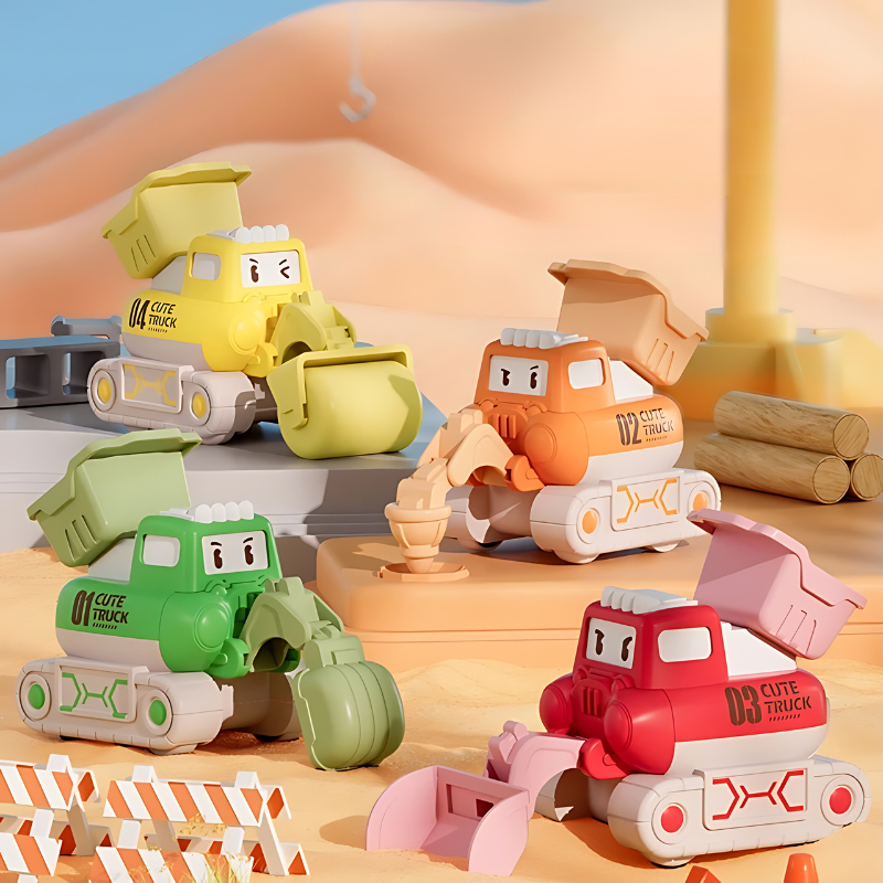 Bunte Spielzeug-Baufahrzeuge im Sand, Kinderbagger, Kunststoff, Baustelle, Outdoor-Spielzeug.
