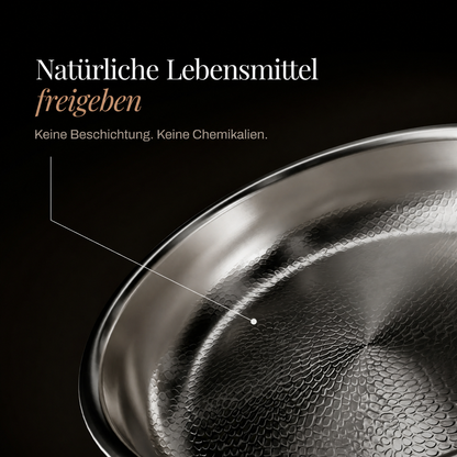 Nahaufnahme der gehämmerten, unbeschichteten Kochfläche mit feiner Schuppenstruktur und glänzendem Rand. 4