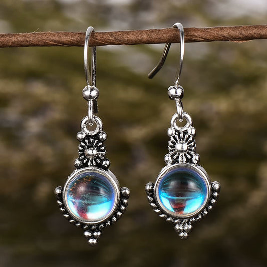 Silberne Ohrringe mit blauem Glaskristall, filigranes Design, handgefertigter Schmuck.