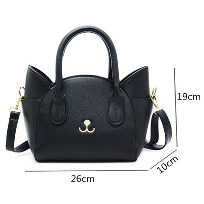 Schwarze Katzenhandtasche aus Leder mit Schulterriemen, 26x19x10 cm, modisches Accessoire.