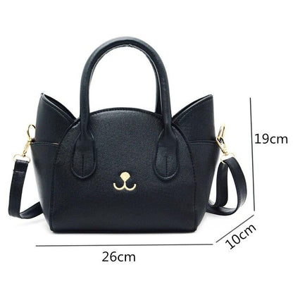 Schwarze Katzenhandtasche aus Leder mit Schulterriemen, 26x19x10 cm, modisches Accessoire.