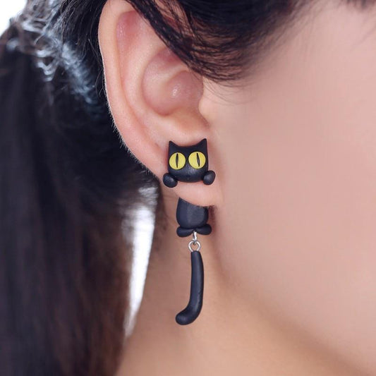 Schwarzer Katzen-Ohrring aus Kunststoff, gelbe Augen, modisches Accessoire für Damen.