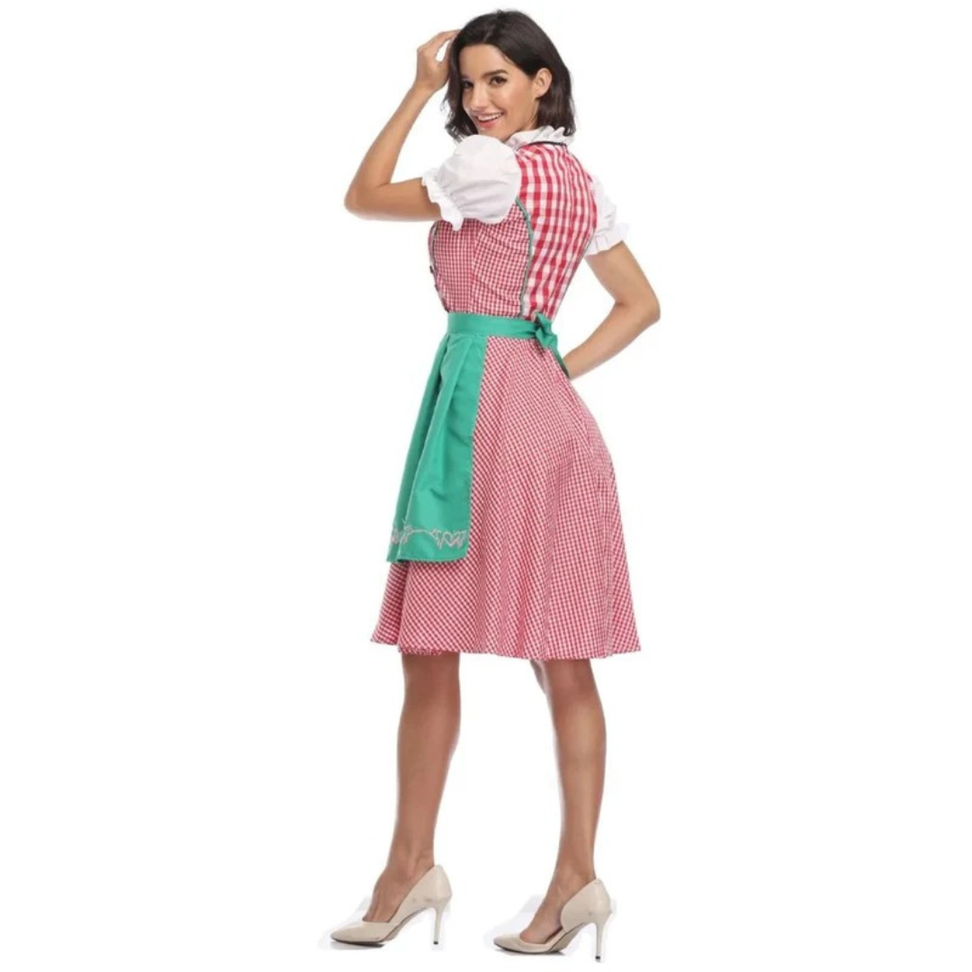 Rückansicht des Dirndls mit rot-weiß kariertem Rücken und grüner Schürze mit Schleife, Model schaut lächelnd über die Schulter. 10
