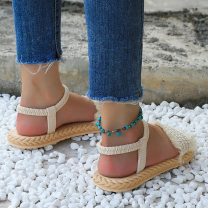 Damensandalen für den Sommer | Flacher Absatz | Trendige beigefarbene Schuhe mit Quasten-Luzern Mode